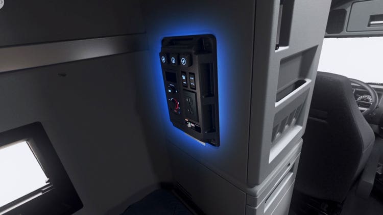 Truck control panel for outlets, ports, stereo, lighting, and HVAC control.
